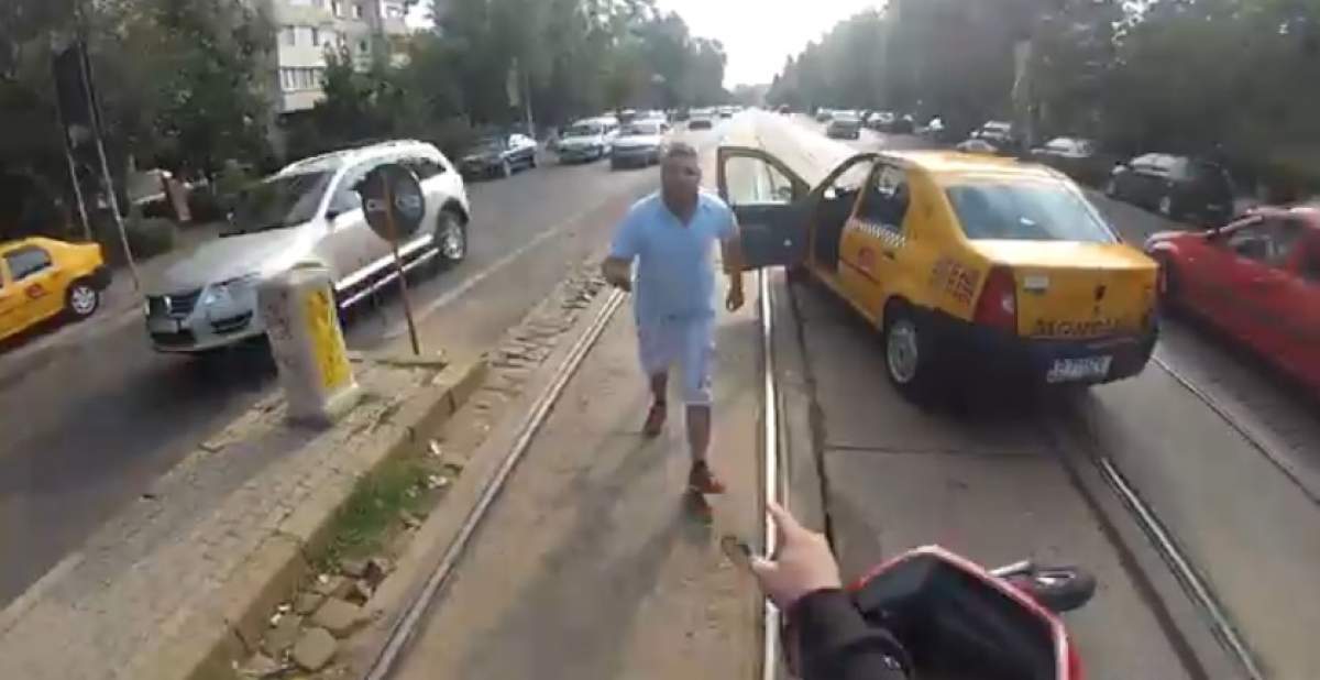 Haos pe străzile Capitalei! Un taximetrist nervos a pus la pământ un scuterist în trafic!