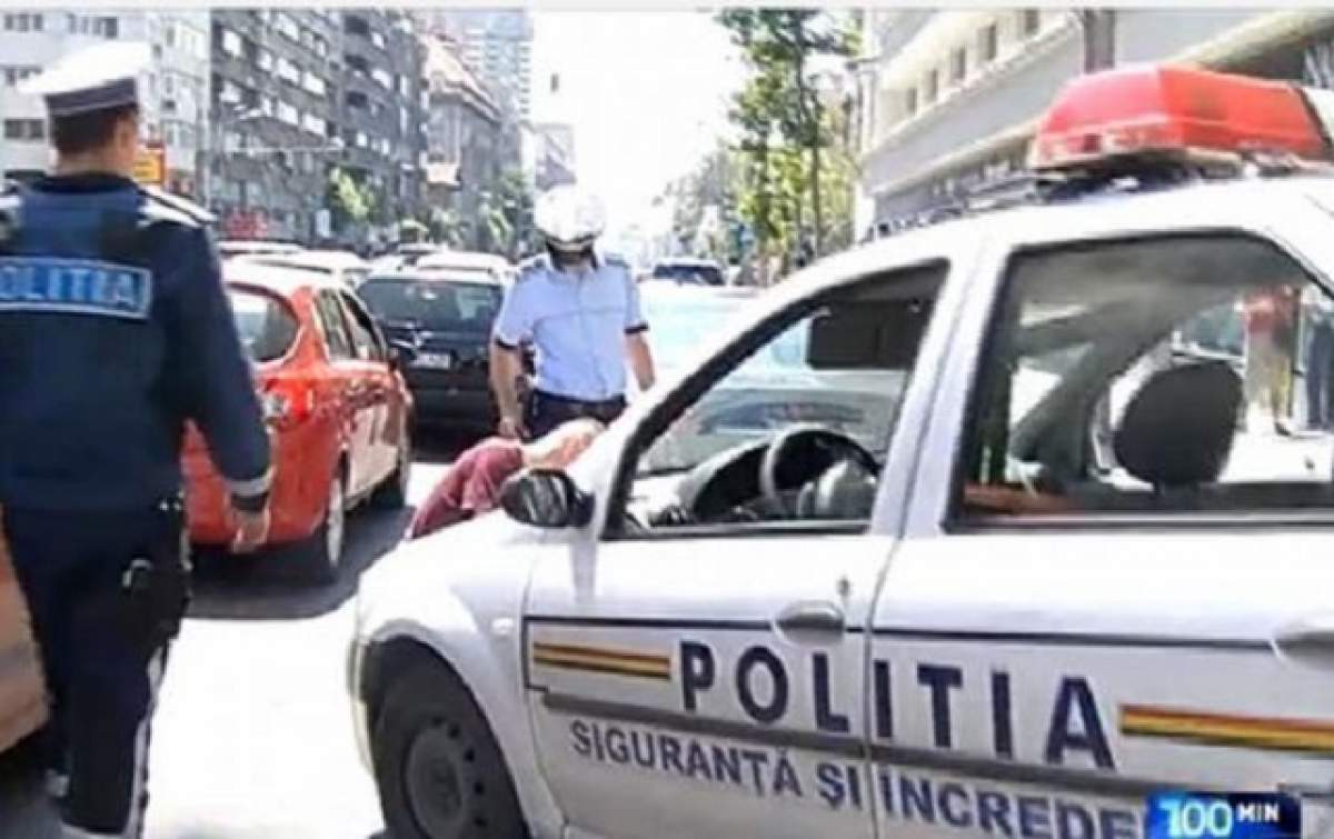 INCREDIBIL! O femeie enervată în trafic a aruncat în poliţişti cu propriul copil