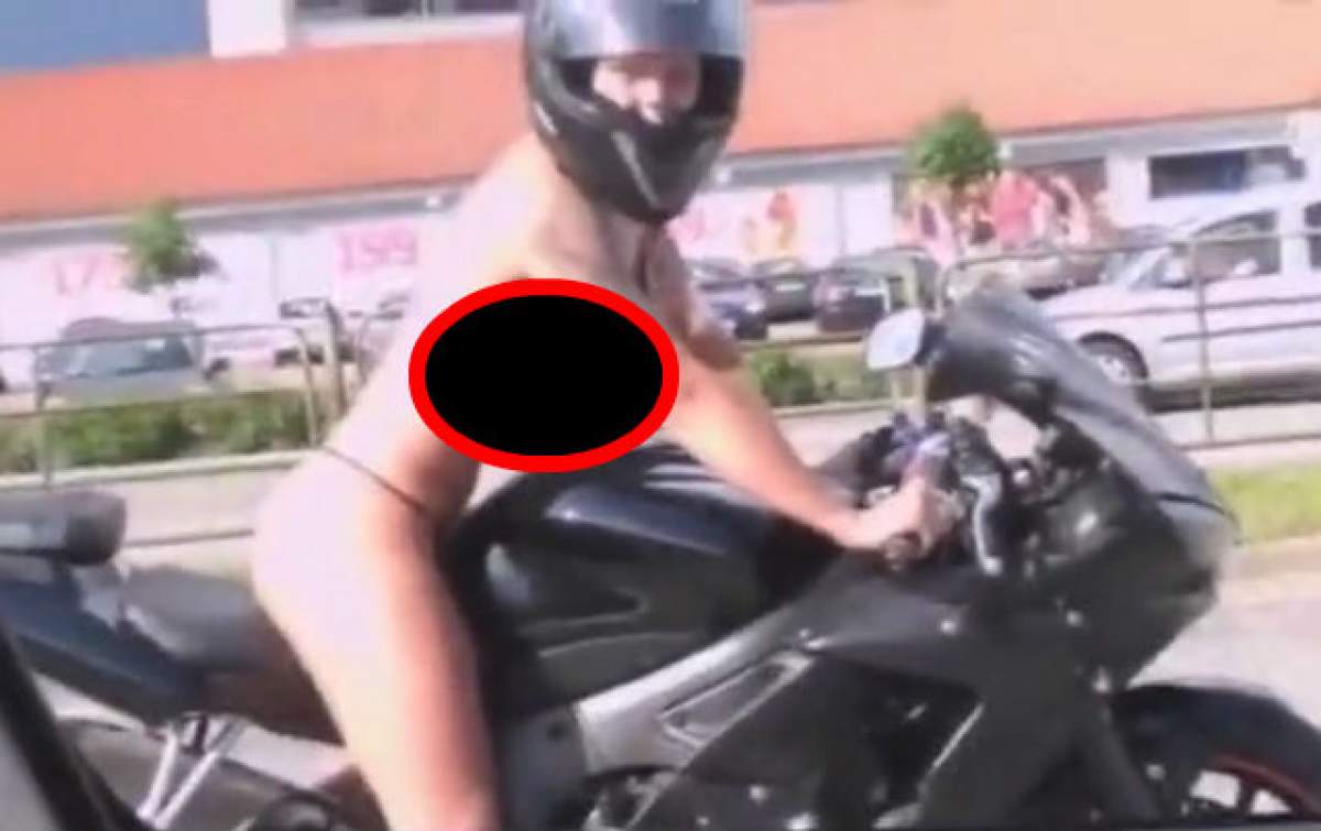 O călăreşte în sânii goi! Motociclista asta a gonit aşa pe şosea şi le-a luat minţile tuturor şoferilor