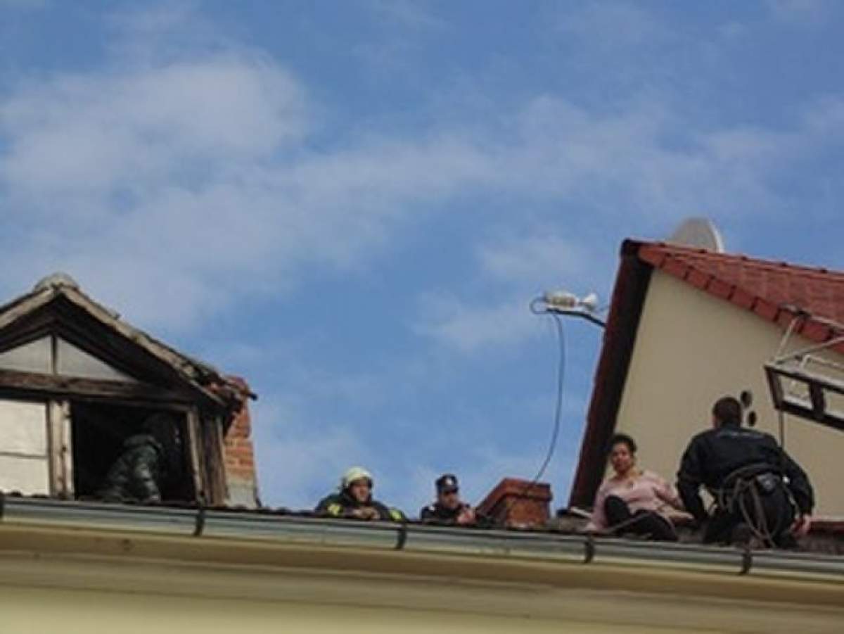 VIDEO Scene incredibile în Sibiu! O braziliancă beată s-a urcat pe un acoperişul unei pensiuni şi a ameninţat că se aruncă