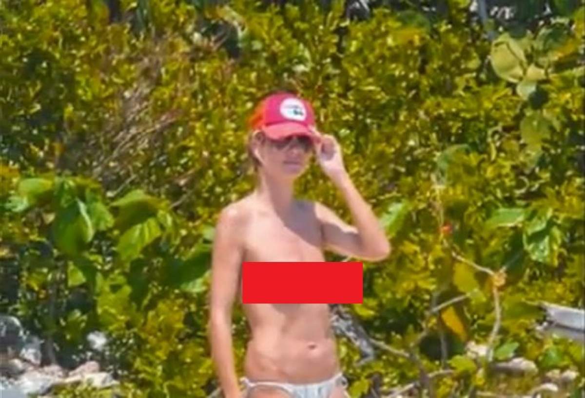 VIDEO Heidi Klum, fără sutien la plajă! Cum arată sânii ei la 40 de ani