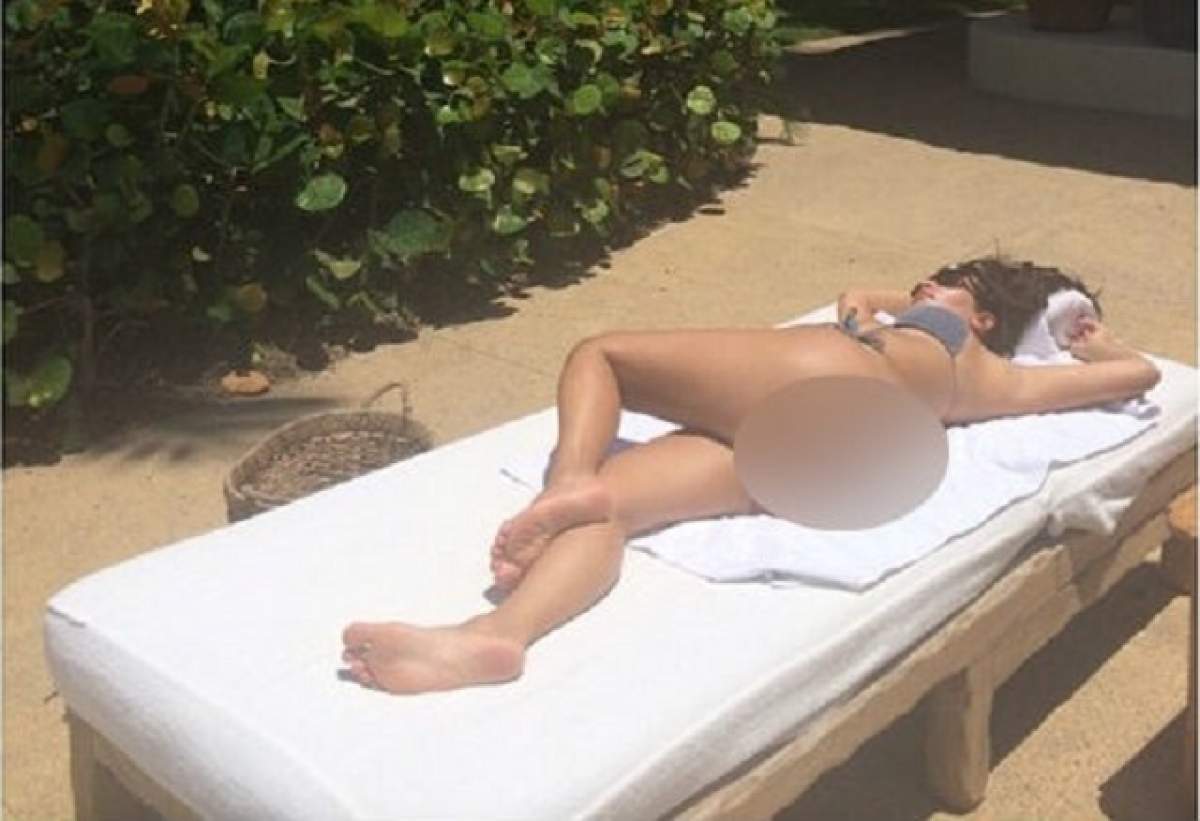 Kim Kardashian a adormit la plajă şi a omis un detaliu! Priveliştea incendiară pe care a oferit-o bruneta