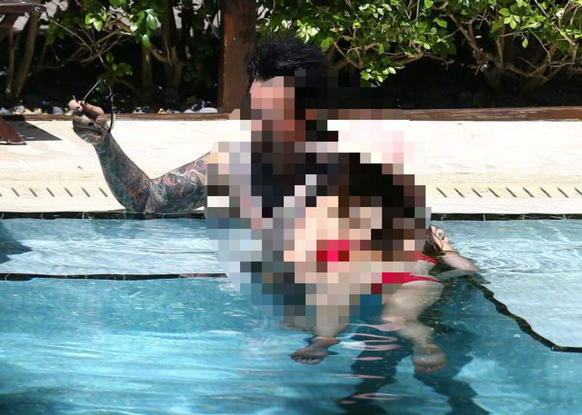 FOTO / Atingeri pătimaşe şi sărutări fierbinţi la piscină! Un cuplu din showbiz şi-a dat frâu liber sentimentelor în public