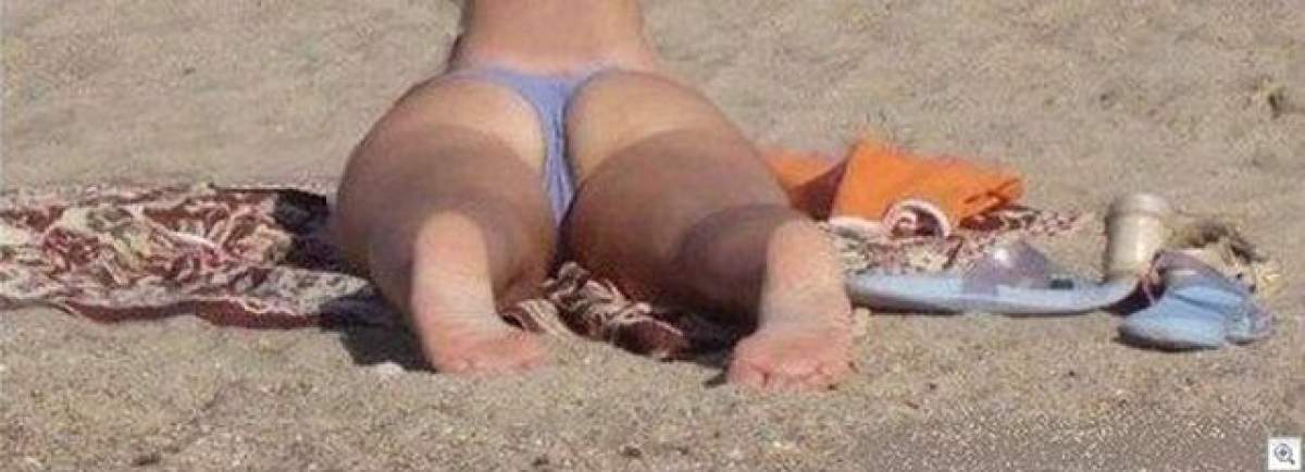 La prima vedere pare doar o femeie obişnuită care stă la plajă! Secretul din spatele acestei fotografii te va şoca!