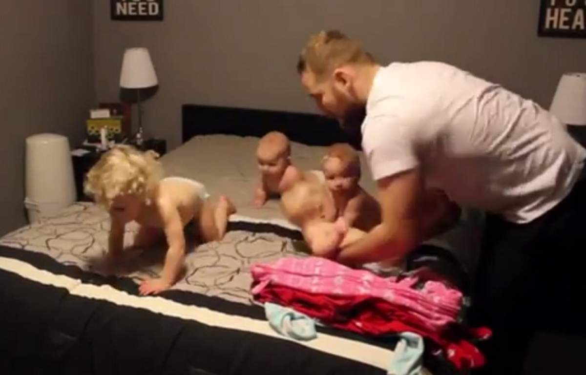 VIDEO / După ce soția sa a făcut înconjurul lumii cu imaginile în care își îmbracă cei patru bebeluși, a venit rândul său. Care s-a descurcat mai bine