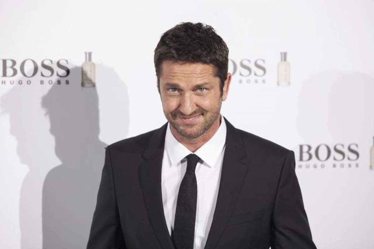 S-a despărţit de iubită şi a mers la un hotel de lux cu alta! Ea este blonda celebră care îl consolează pe Gerard Butler