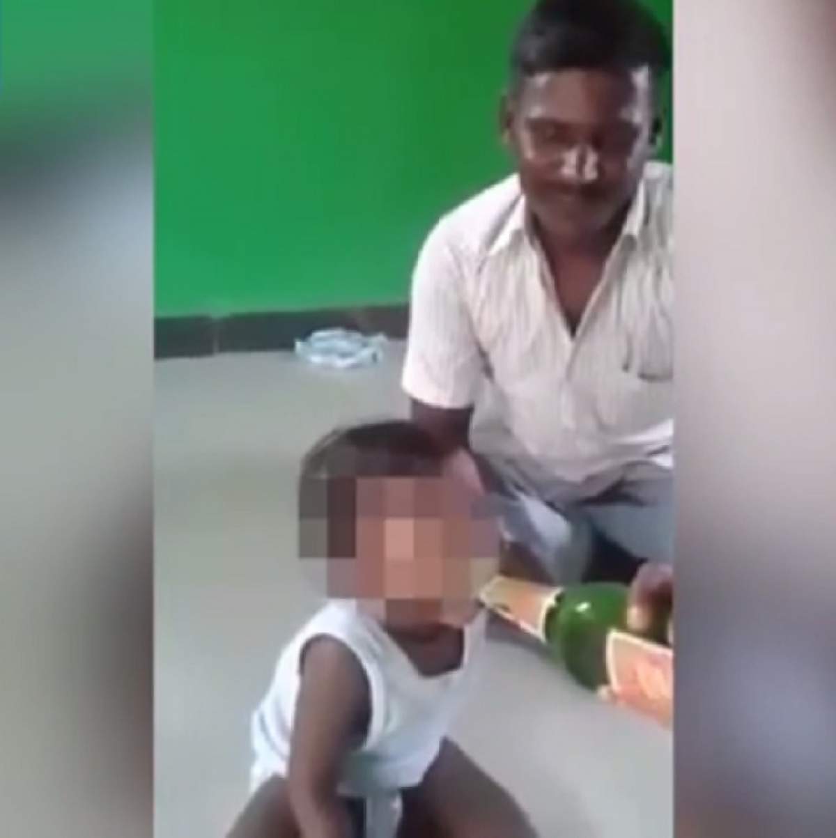 VIDEO / Clipul revoltător în care un tată își forțează copilul să bea bere! Imagini de necrezut