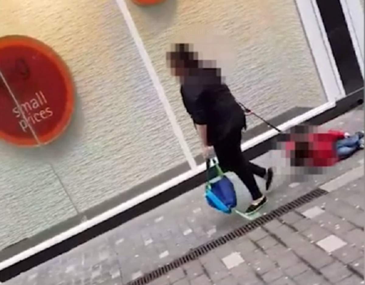 VIDEO / Șocant! O femeie târăște un copil pe stradă ca pe un animal în lesă. Imaginile sunt uluitoare
