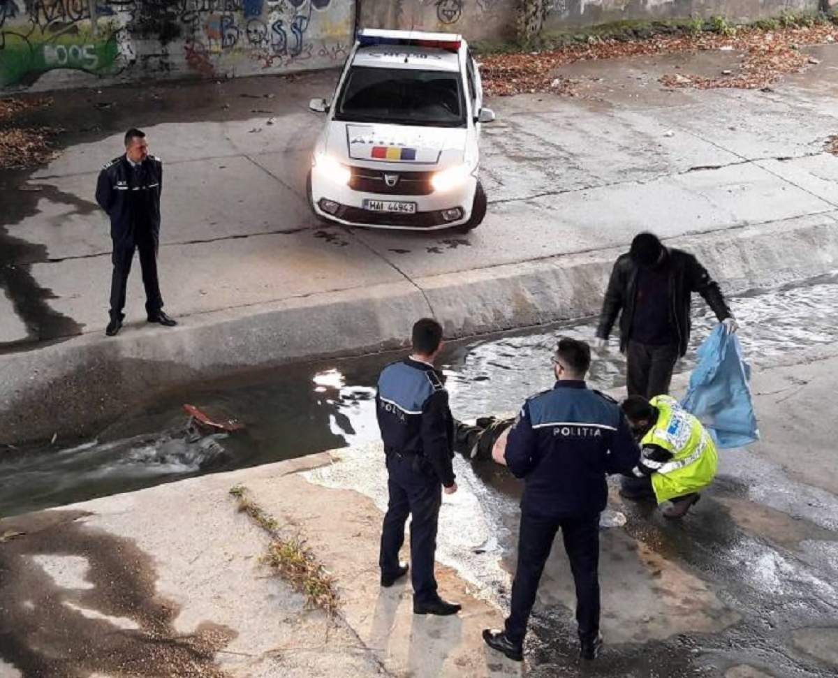 FOTO / Descoperire sumbră în Piatra Neamț! Cadavru, cu capul băgat într-un canal. Imagini șocante