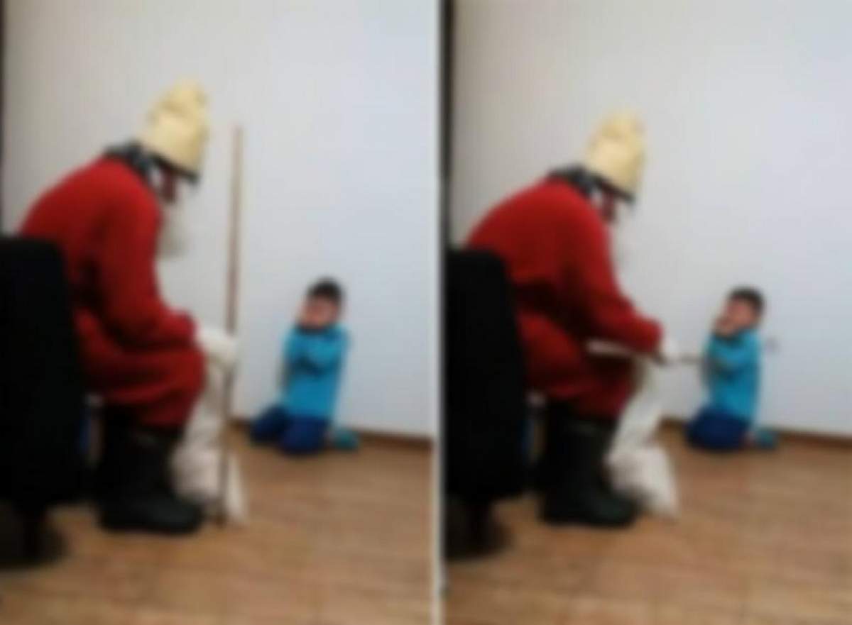 VIDEO / Imagini şocante de sărbători! Un copil este terorizat şi bătut cu un băţ de iubitul mamei lui, îmbrăcat în Moş Nicolae