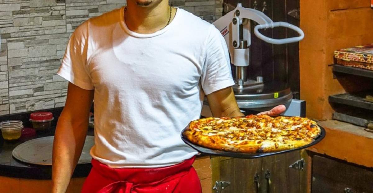 Incredibil! Un român a fost atacat cu drujba, în timp ce livra pizza în Germania