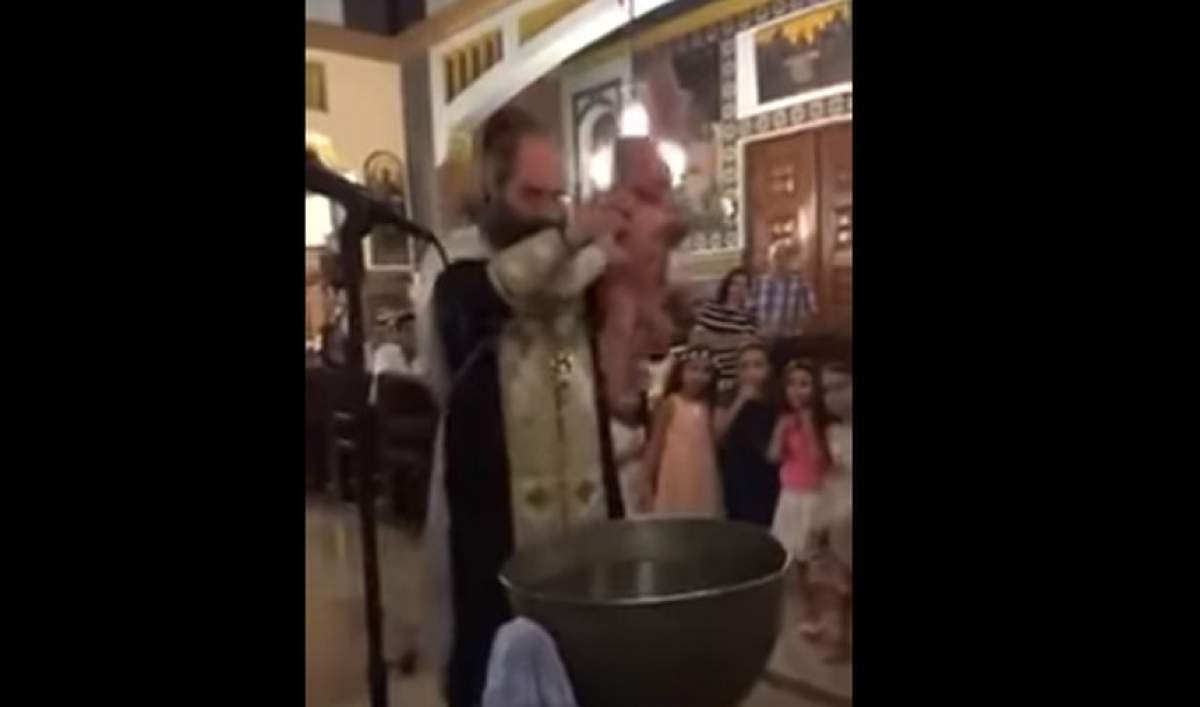 VIDEO / Un preot a bruscat un bebeluș în timpul botezului. De ce nimeni nu a intervenit. Explicația te va lăsa cu gura căscată