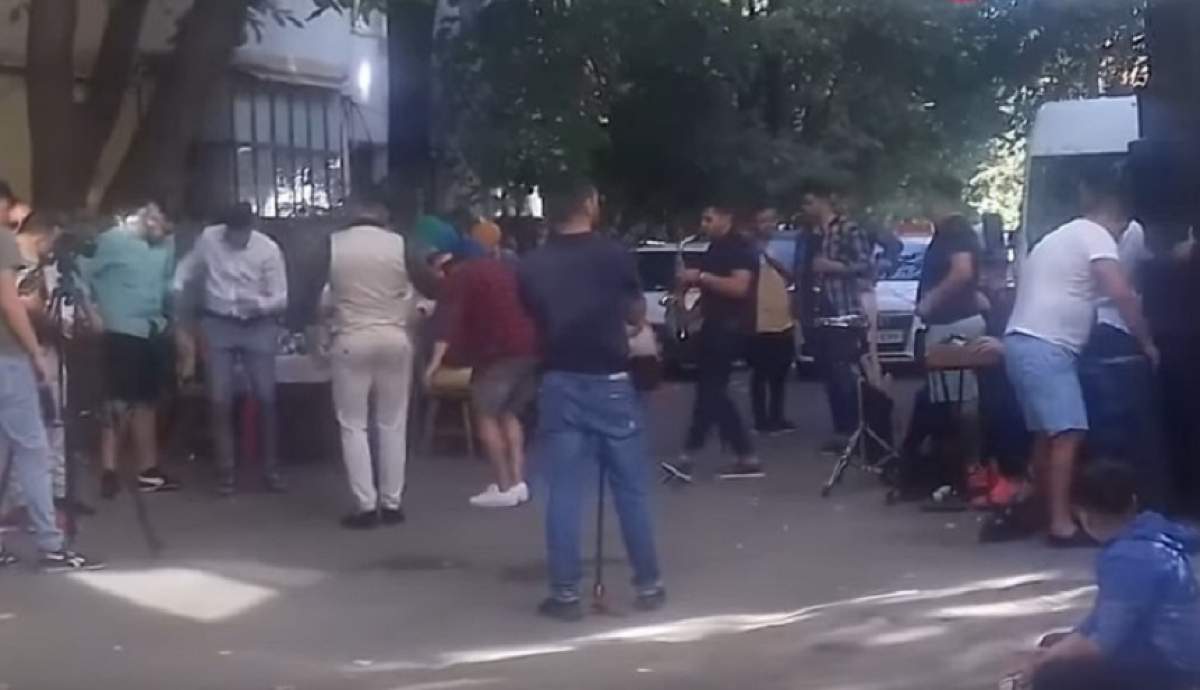 VIDEO / Imagini incredibile pe o stradă din Bârlad! Au făcut botez printre blocuri, cu mese întinse și maneliști