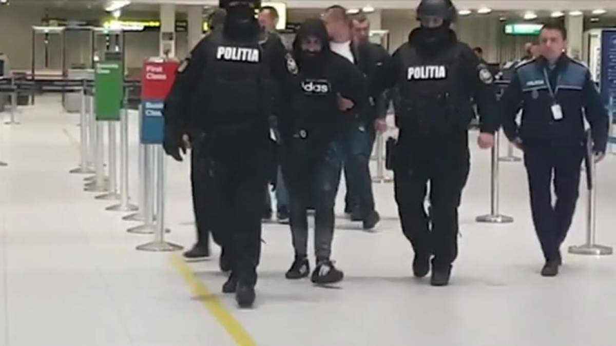 Ultima oră! Un urmărit internaţional a fost adus în ţară! Imaginile momentului de pe aeroportul Otopeni / VIDEO