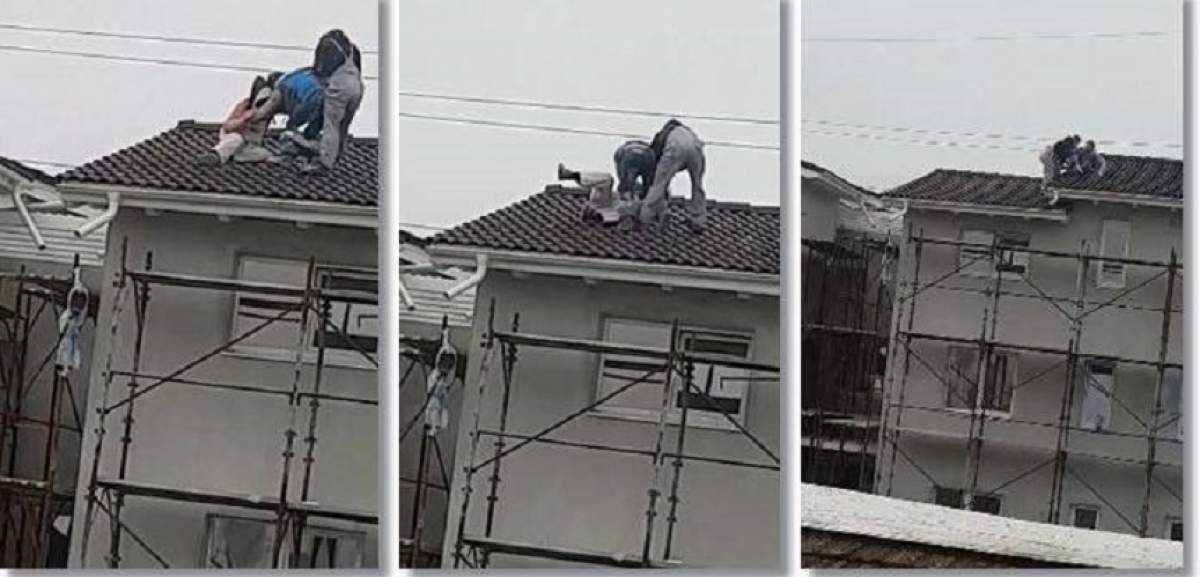 VIDEO / Muncitori beţi, filmaţi pe acoperişul unei case din Timiş. Unul dintre ei îşi pierde pantalonii