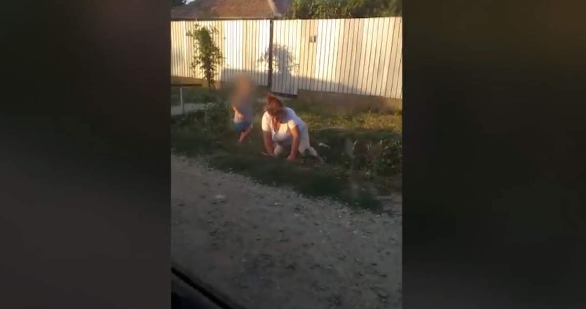 O femeie din Călărași, beată moartă, cade pe marginea drumului, în timp ce copilul îi ține berea. VIDEO
