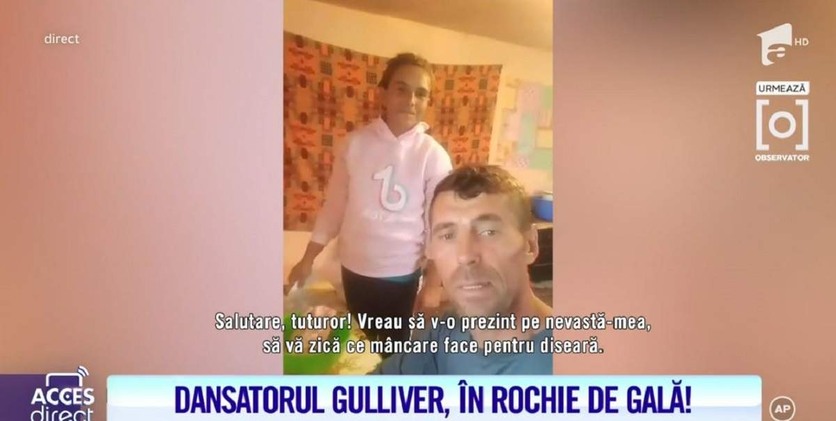 Alexandra și Ionuț Bodi în bucătărie. Femeia gătește și poartă un hanorac roz.