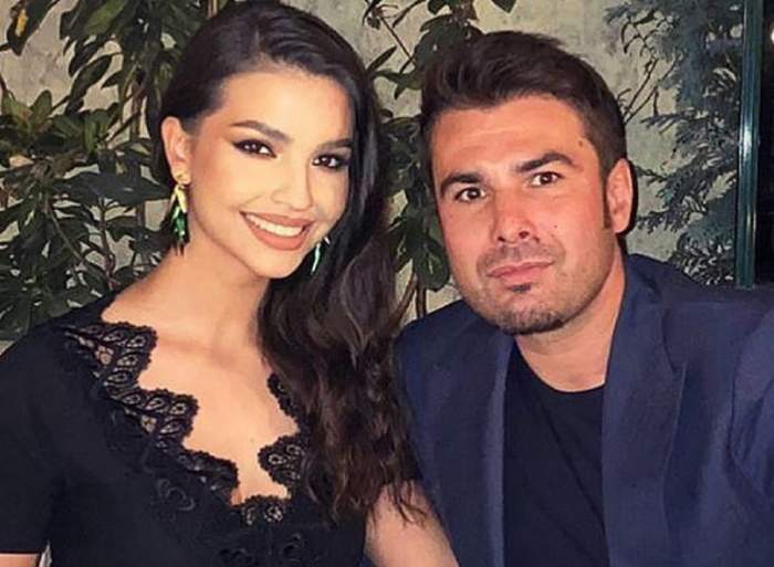 Adrian Mutu și soția lui, Sandra. Ea poartă o rochie neagră, iar el un costum albastru.