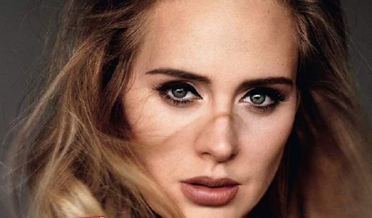 Adele este la o sedinta foto, este machiata strident si are parul suflat