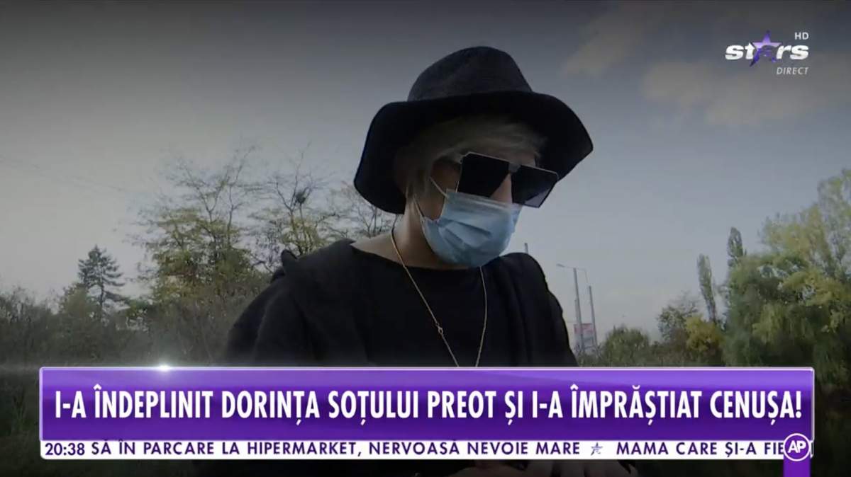 Florin Marin poarta haine negre, ochelari de soare si masca de protectie. este intr-un parc din Capitala