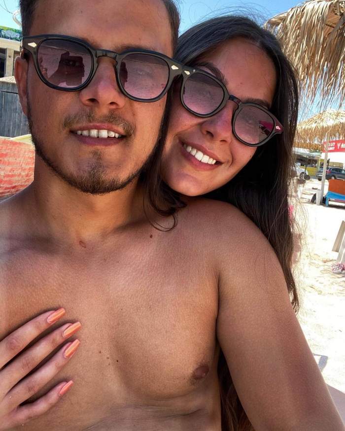 Ionuț Belei și iubita s-au fotografiat la plajă, zâmbitori și îmbrățișați