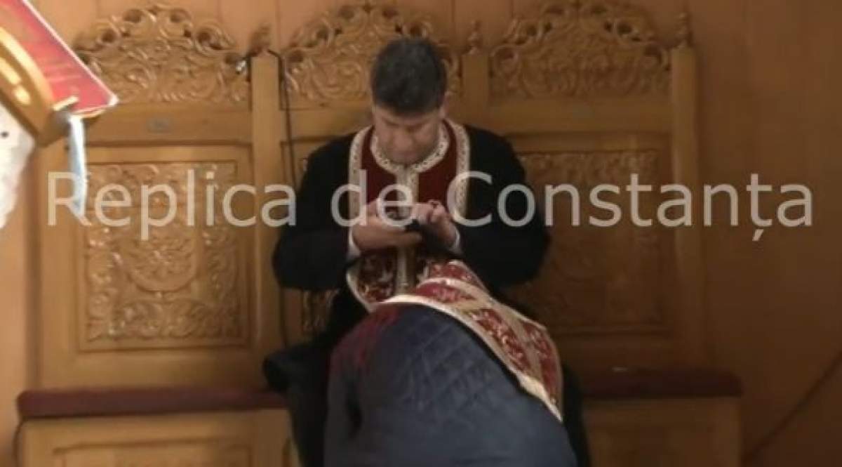 Un preot din Năvodari, surprins în timpul spovedaniei butonând telefonul / VIDEO