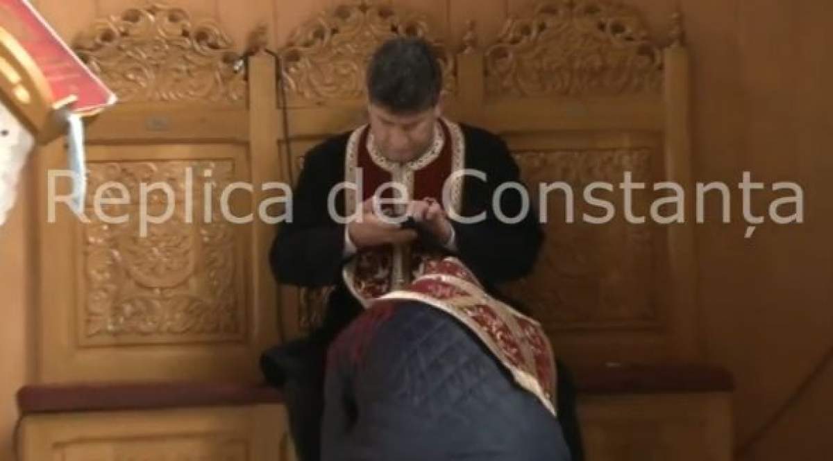 Reacţia Arhiepiscopiei în cazul preotului din Năvodari. Omul bisericii butona telefonul în timpul slujbei / VIDEO