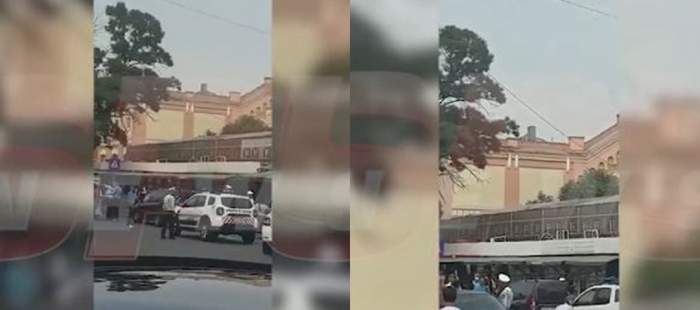 VIDEO / Panică în Capitală! Un bărbat a amenințat că se sinucide, după ce s-a urcat pe o clădire din Piața de flori George Coșbuc. Echipajele de salvare au intervenit de urgență