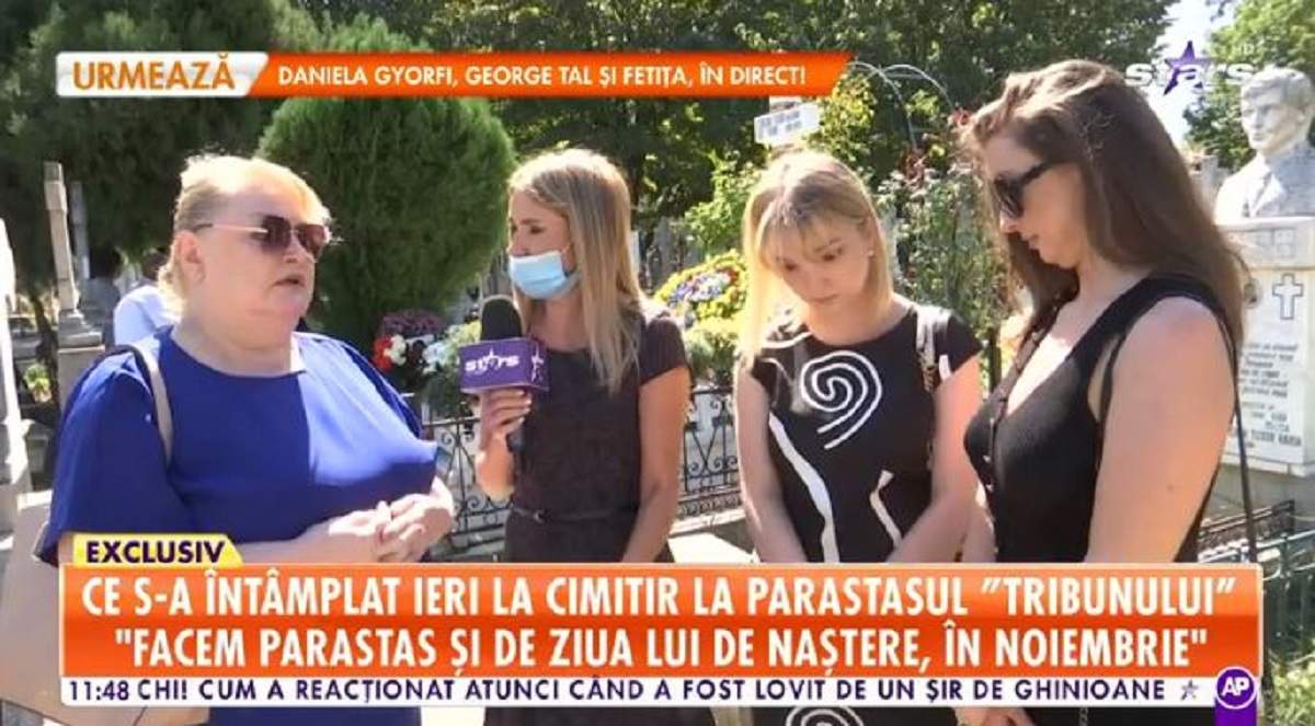 În imagine este văduva lui Corneliu Vadim Tudor alături de fiicele sale, Eugenia și Lidia. Cele 3 se află la mormântul „Tribunului” și dau un interviu pentru „Antena Stars”.