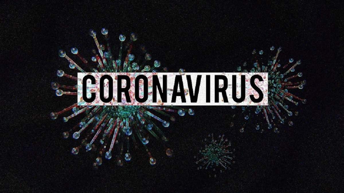Virus pe fundal negru pe care scrie coronavirus