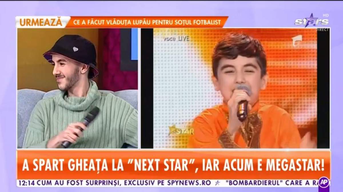 Omar este in platou la Antena Star, poarta palarie si hanorac verde