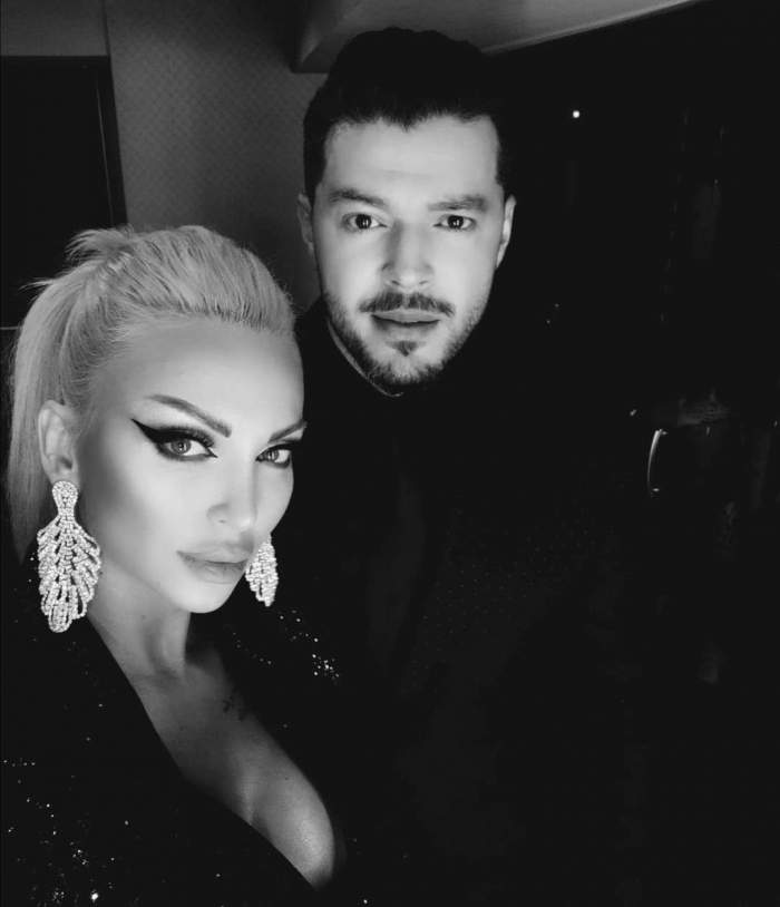 Victor Slav, fotografiat alături de iubita sa, ambii îmbrăcați în negru