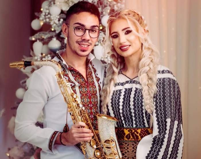 Armin Nicoară și Claudia Puican, fotografiați cu saxofonul în brațe