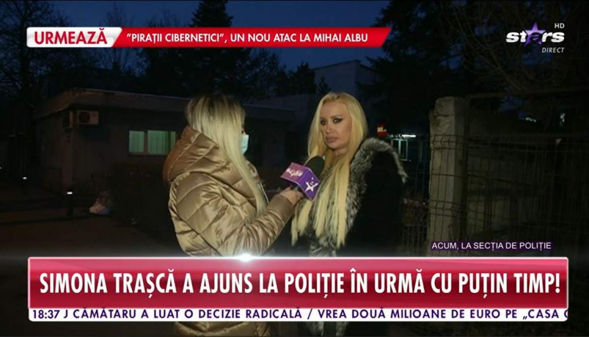 Simona Trasca este afara in fata sectiei de politie cu reporteru Antena Stars, poarta haine groase si are parul desprins