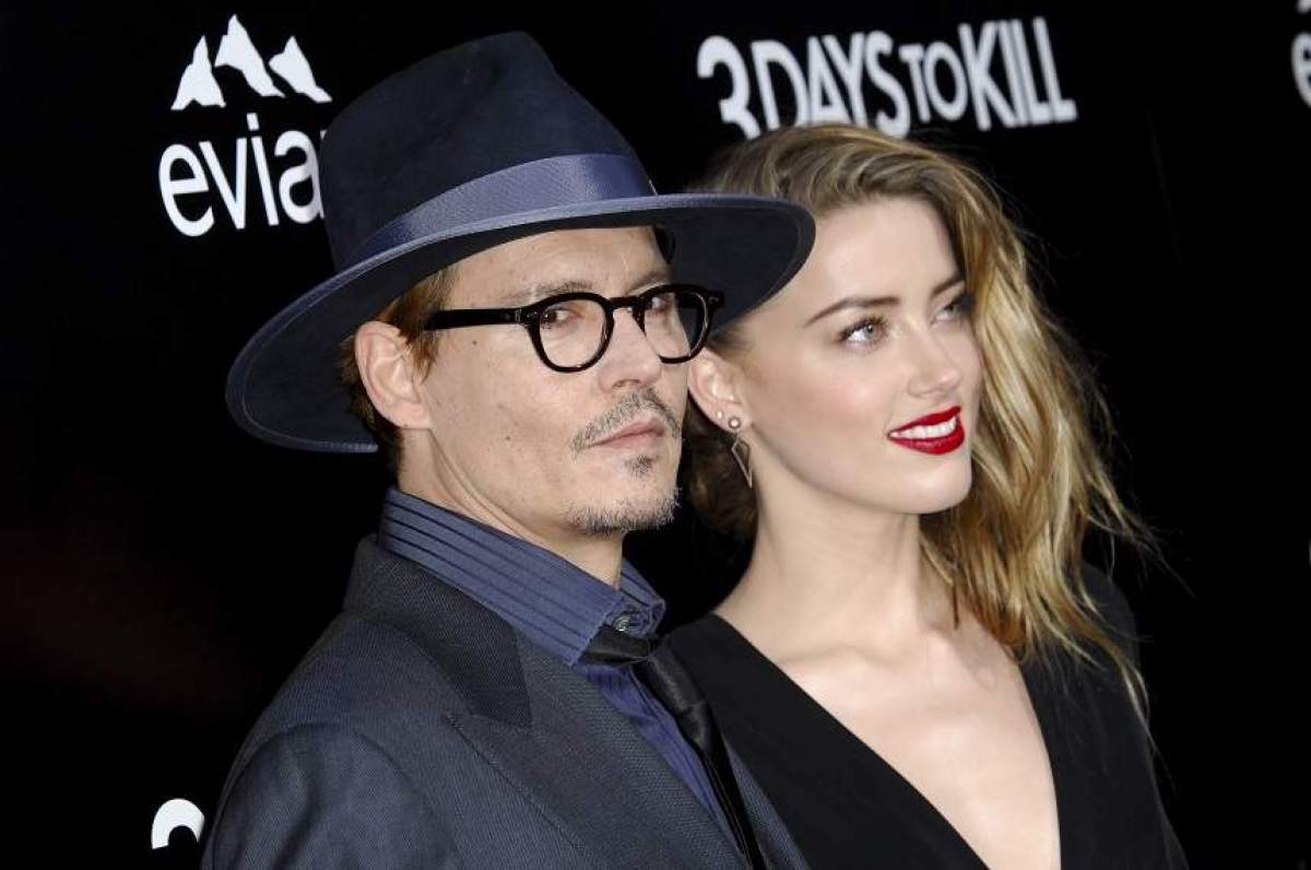 Johhny Depp si Amber Heard, imbracati elegant pe covorul rosu