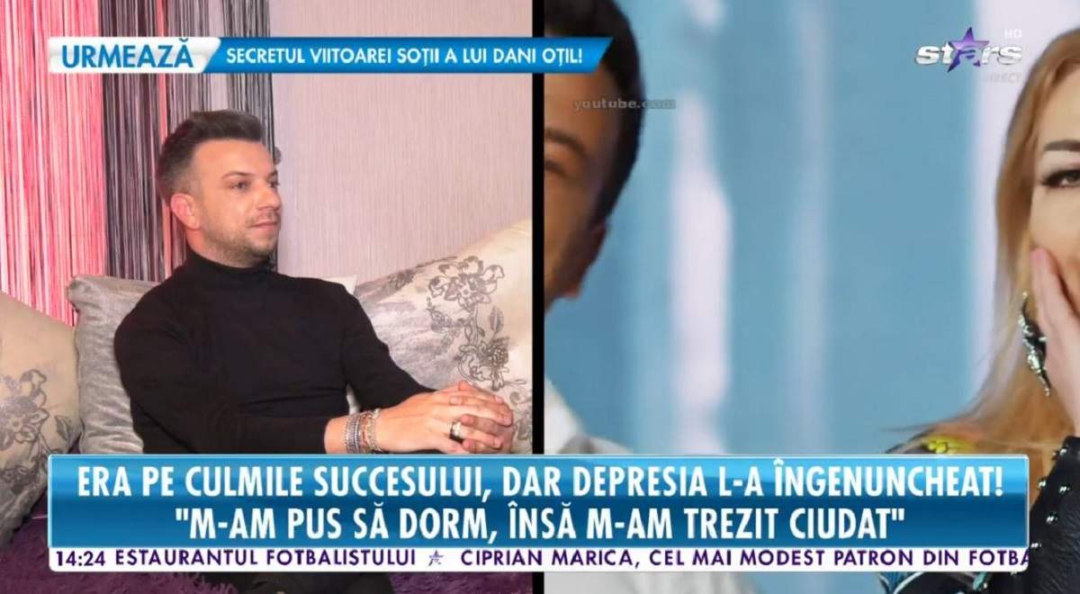 Alex de la Orăștie oferă un interviu pentru Antena Stars. Artistul poartă o bluză neagră.