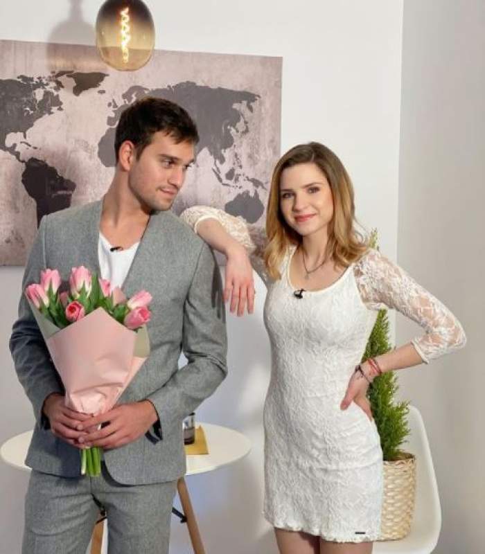 vlad gherman tinand un buchet de flori in maini alaturi de cristina ciobanasu imbracata in rochie scurta