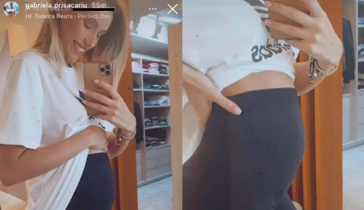 Gabriela Prisăcariu poartă un tricou alb și colanți negri. Vedeta le arată fanilor de pe Instagram burtica de gravidă.