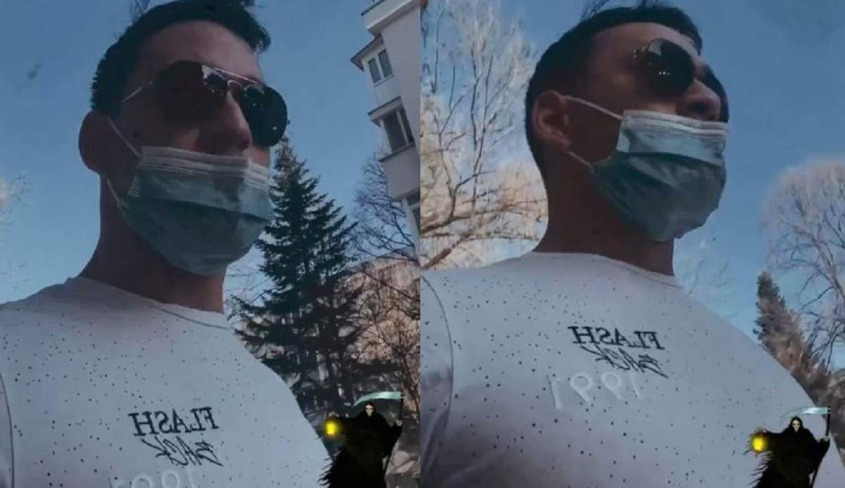 Vlad Gherman poartă un tricou alb și mască de protecție. Actorul are ochelari de soare la ochi.