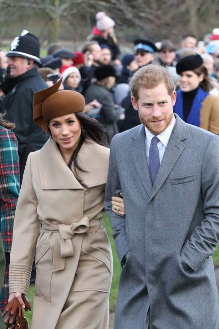 Meghan Markle și Harry, îmbrăcați în paltoane crem și gri