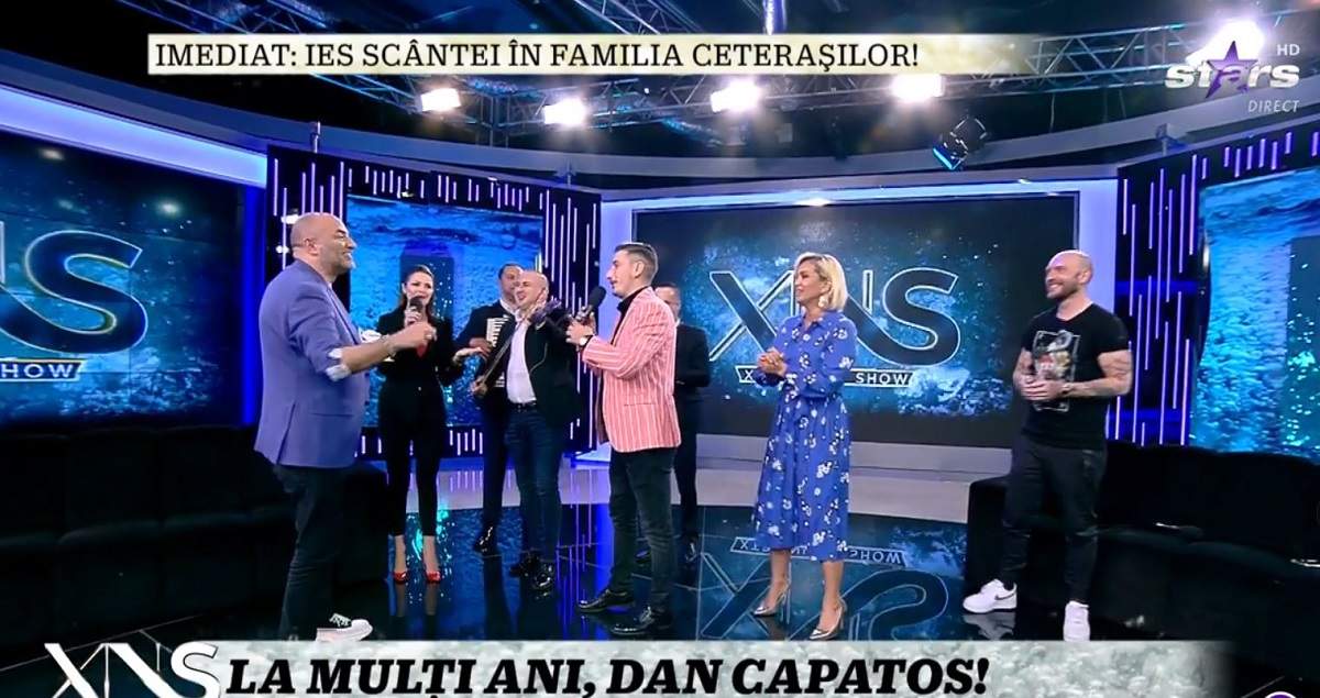 Dan Capatos e la Xtra Night Show și ține în mână un tort aniversar. Amalia Ursu și Vasilică Ceterașu îi cântă „la mulți ani”. În platou sunt și Paula Chirilă și Cătălin Bordea.