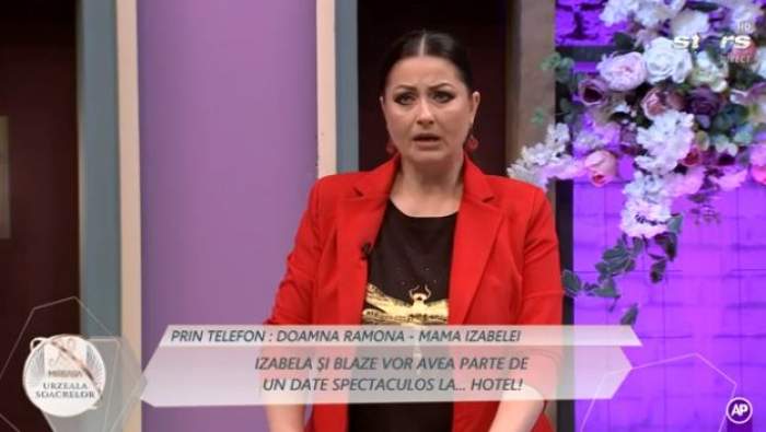 Gabriela Cristea, îmbrăcată în roșu și negru