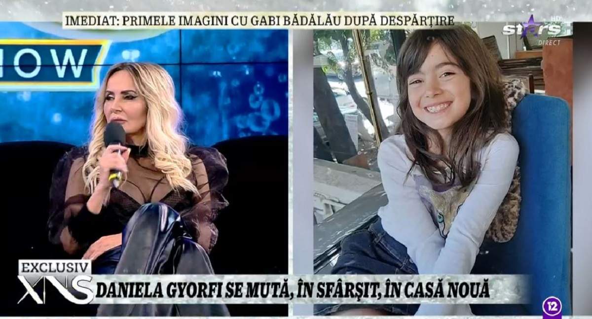 Daniela Gyorfi stă pe canapea la Xtra Night Show și poartă o bluză neagră și pantaloni din piele. În dreapta e o poză cu fiica ei, Maria.
