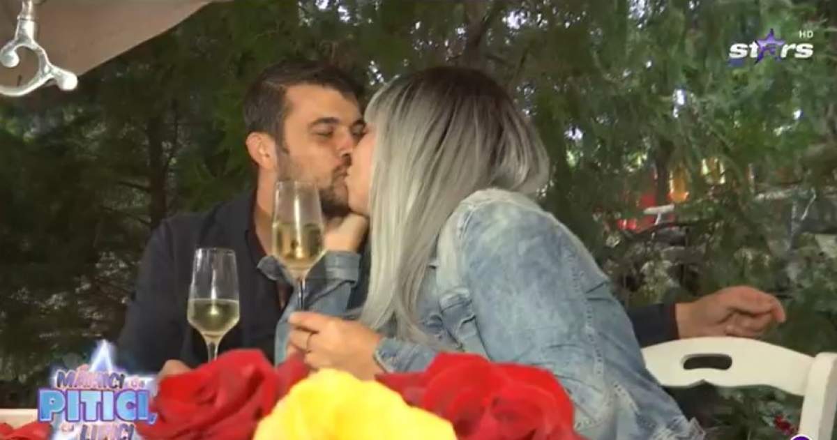 Oana Roman și Marius Elisei sărutându-se la cină