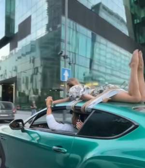 Un cunoscut influencer din Rusia şi-a legat iubita cu frânghia de plafonul maşinii, apoi s-a plimbat cu ea pe străzile oraşului / FOTO
