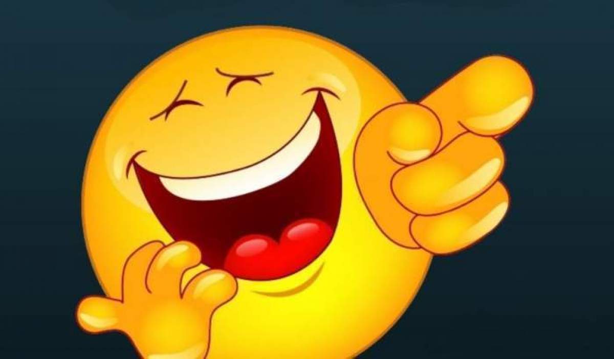 Un emoji amuzant care arată cu degetul și râde