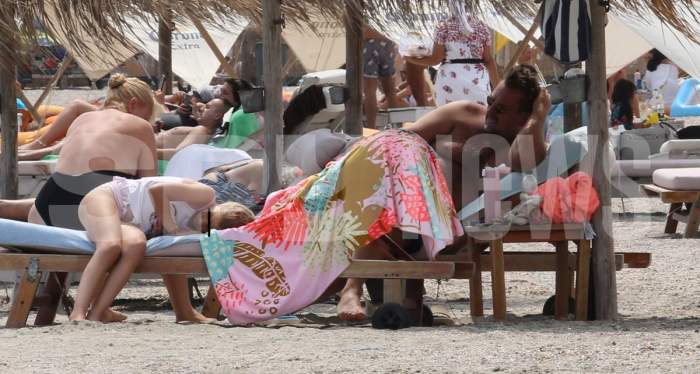 Horia Brenciu, atent cu soția sa, la plajă. Cântărețul știe cum trebuie să-și răsfețe partenera / PAPARAZZI