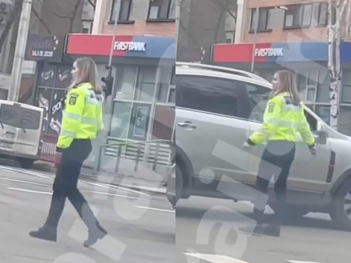 O polițistă a devenit virală și a atras critici în mediul online. O polițistă dirijează traficul.