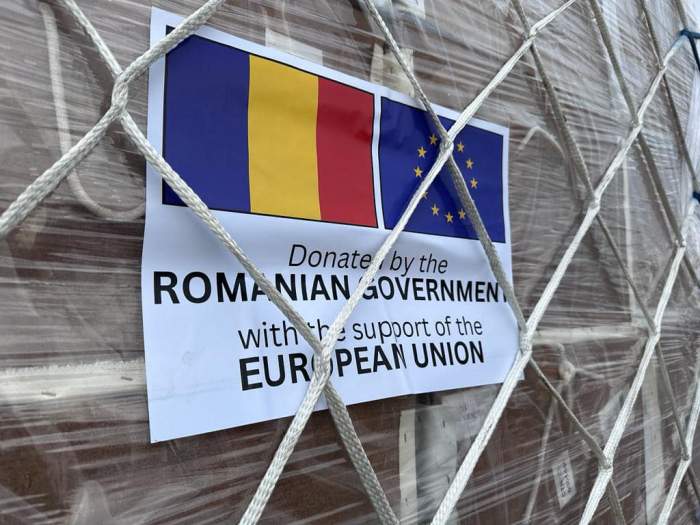 O foaie cu steagul României și Uniunea Europeană, ajutor din partea României pentru Fâșia Gaza