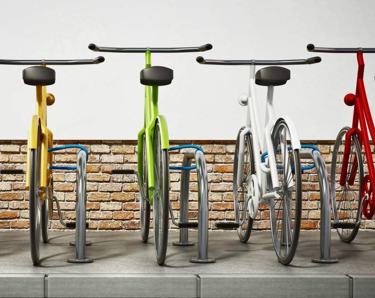 Biciclete colorate în zona de parcare pentru biciclete. Ilustrație 3D